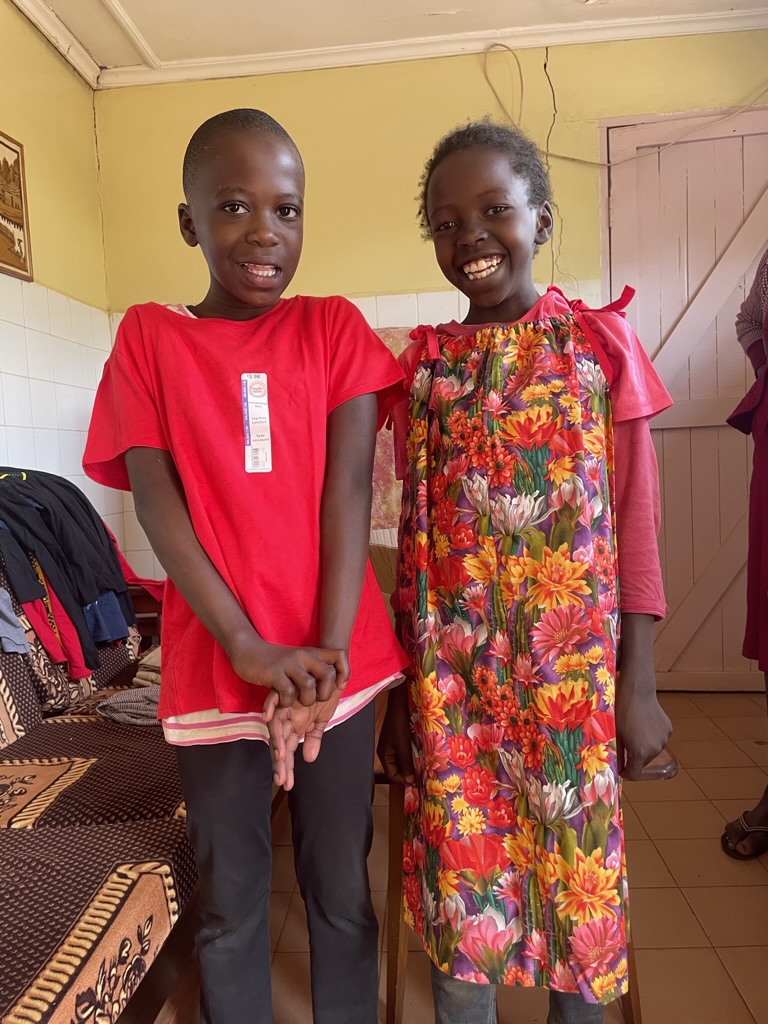 Two happy kids with new clothes.